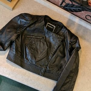 Black polyester bolero style jacket.  This is an a